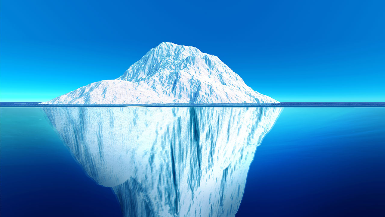 Tip and keel of an iceberg in the middle of the ocean